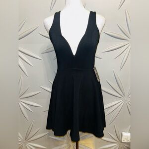 NWT Express SZ XS Black plunge neckline mini dress/SKORT. Bust 30”-32”